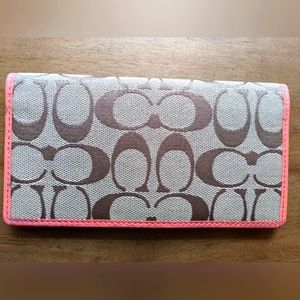 Vintage Coach checkbook cover signature pattern in brown.